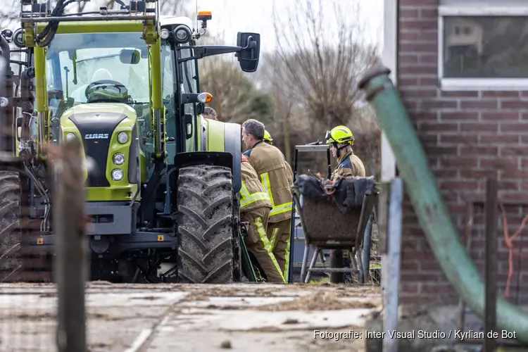 Persoon met been onder tractor in Haarlem